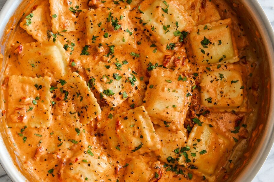 Pillow-y ravioli with the dreamiest, most velvety sun dried tomato cream sauce! A 30-minute weeknight dinner yet fancy enough for company!