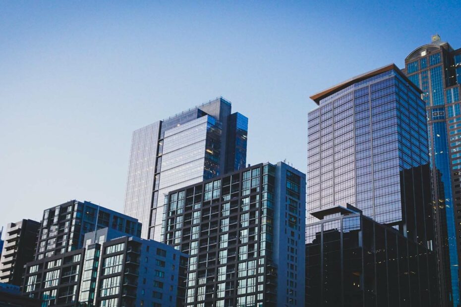a skyline of high rise buildings at dusk